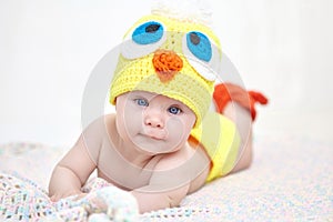 Cheerful baby in chicken hat