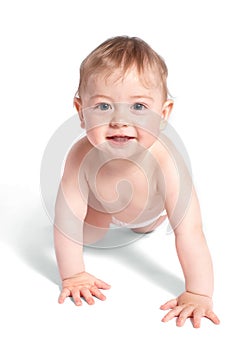 Cheerful baby creeps on white photo
