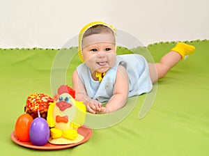 The cheerful baby with an easter entertainment