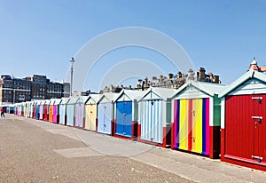 Cheerful beach huts in Pride rainbow colours in Brighton