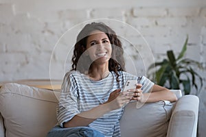 Cheerful beautiful mobile phone user woman head shot indoor portrait