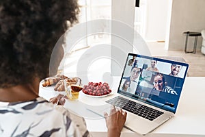 Cheerful beautiful woman using laptop