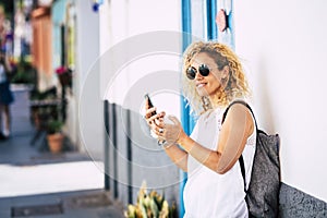 Cheerful beautiful young caucasian woman portrait in outdoor leisure activity - travel people and tourism tourist with backpack