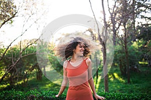 Cheerful black afro woman outdoors