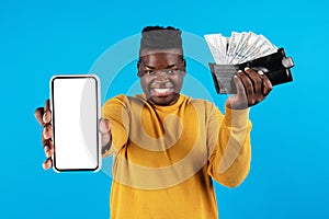 Cheerful Black Male Demonstrating Blank Smartphone And Wallet With Dollar Cash Money