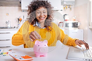Cheerful black woman saving money for the future