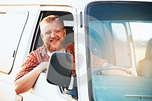 Cheerful blonde driver driving his car