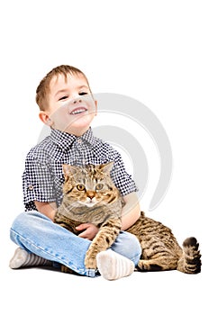 Cheerful boy hugging a cat Scottish Straight