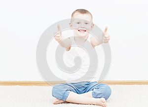 Cheerful boy with thumbs up