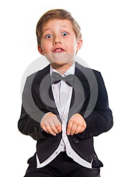 Cheerful boy in a tuxedo.