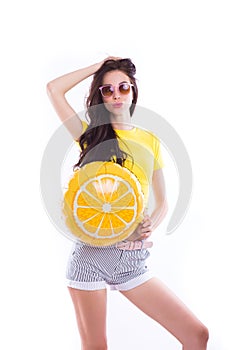 Cheerful Bright Girl in glasses with a yellow balloon on an isolated white background.