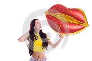 Cheerful Bright Girl in glasses with a yellow balloon on an isolated white background.