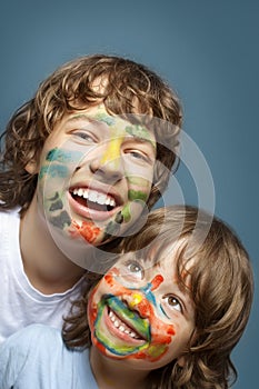 cheerful brothers with painted faces