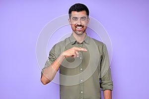 cheerful brunette bearded man demonstrating the letter H