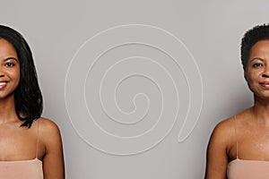 Cheerful brunette woman with straight and curly hair isolated on white background