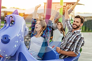 Cheerful buddies relaxing on playground photo