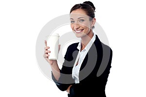 Cheerful business lady holding beverage