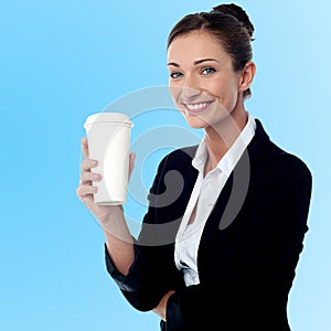 Cheerful business lady holding beverage