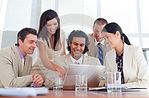 Cheerful business partners working at a computer