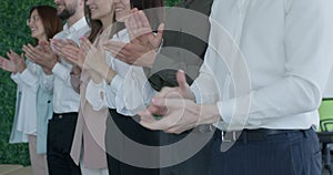 Cheerful business people clapping hands during seminar, success and achievement concept