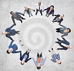 Cheerful Business People Holding Hands Forming a Circle photo