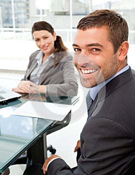 Cheerful business people sitting at a table