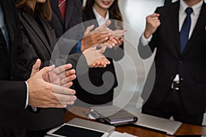 cheerful businessman applauding at conference. successful business team clapping hands for great work