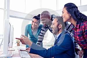 Cheerful businessman giving training to team