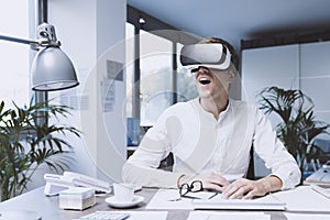 Cheerful businessman interacting with virtual reality