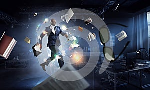 Cheerful businessman jumping high. Mixed media photo