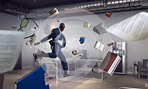 Cheerful businessman jumping high. Mixed media photo