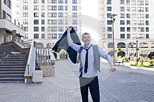 Cheerful businessman thumbs up posing and smiling at camera