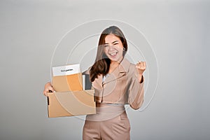 A cheerful businesswoman celebrating after quitting her job. white  background