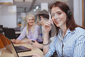 Cheerful call center operator at work