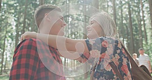 Cheerful caucasian couple spending time in a forest.