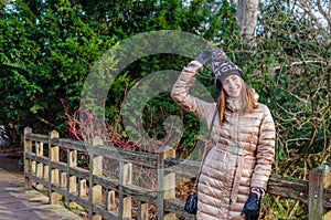 Cheerful caucasian young woman having fun in park