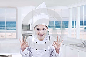 Cheerful chef showing OK symbol