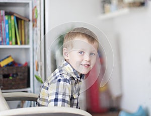 Cheerful child in children's room photo