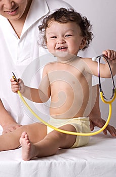Cheerful child at the doktor. photo