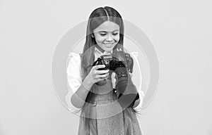 cheerful child girl take photo with digicam, photography