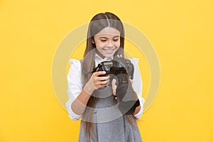 cheerful child girl take photo with digicam, photography