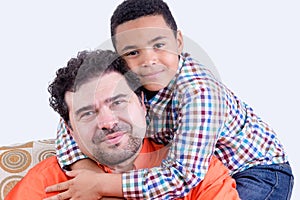 Cheerful child hugging father