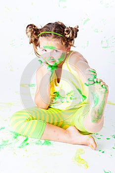 Cheerful child with paint