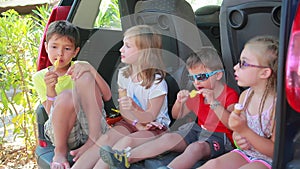 Cheerful children are eating delicious ice cream