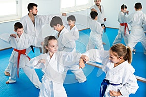 Cheerful children sparring in pairs