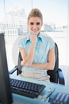 Cheerful classy businesswoman posing