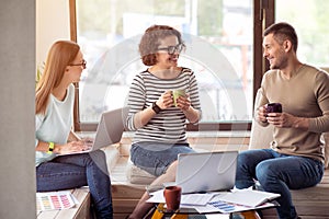 Cheerful colleagues sitting in the office