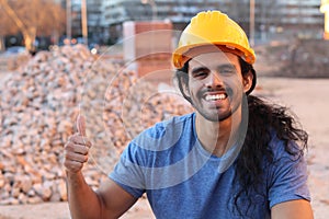 Cheerful construction worker giving thumbs up