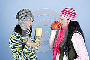 Cheerful conversation women and hot drink