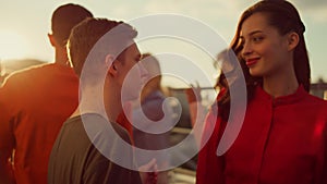 Cheerful couple hanging out at party. Young people partying in urban background